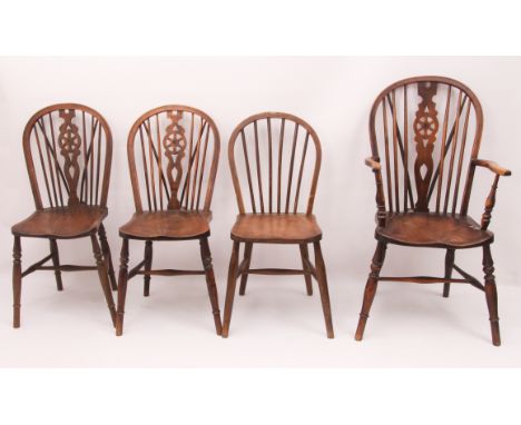 Three late-19th century beech, ash and elm Windsor chairs - comprising an armchair and two similar side chairs, the armchair 