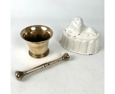 A small 19th century bell metal pestle and mortar - the mortar 8.9cm high; and a Victorian, white enamel jelly mould surmount