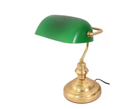 An antique-style brass and green glass library lamp