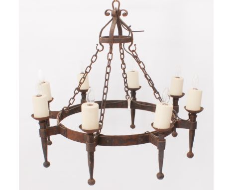 A medieval-style wrought iron ceiling chandelier - probably mid-20th century, the circular frame with eight torch-style light