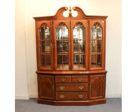 A reproduction cherrywood glazed dresser - late 20th century, in the Georgian style, the swan neck cornice with centred reede