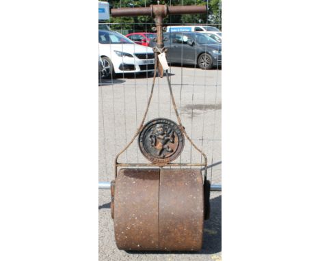 A vintage cast iron garden roller