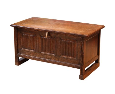 An early 18th century style carved oak small coffer - 1920s-30s, the cleated, boarded top enclosing an interior with a later 