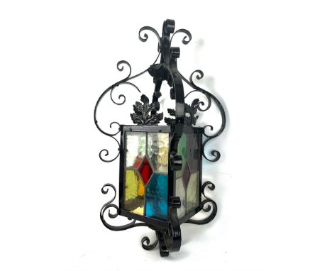 A Victorian style wrought iron and stained glass hall lantern - 57cm high.
