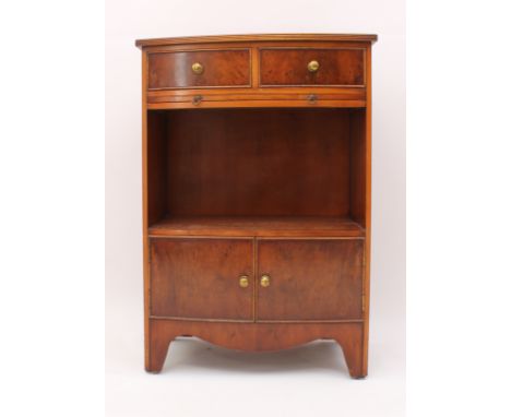A small Regency-style yew veneered bowfront cabinet - the reeded top over two short drawers, a brushing slide, an open shelf 