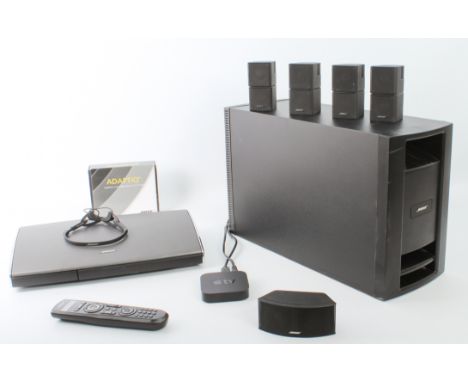 A complete Bose home entertainment system with 5 speakers: 1. AV35 Control Console Model 402455 with remote control and batte