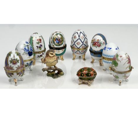 Eight gilt metal and porcelain egg shaped boxes in the style of Limoges - with hinged lids, on tripod feet, 9.25cm high; toge
