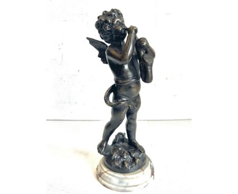 A bronze figure of a cherub playing saxophone (32 cm high)