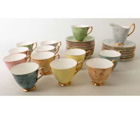 A Royal Albert Gossamer pattern part tea service - printed factory marks, decorated in marbled pastel shades with gilt border