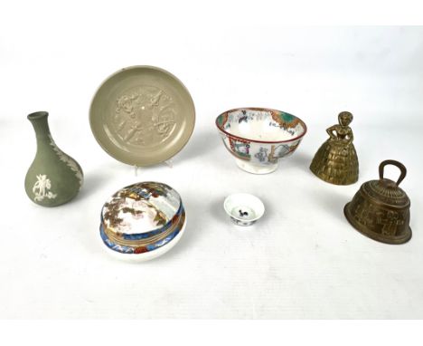 A small group of pottery and porcelain - including a Chinese earthenware celadon glazed erotic subject dish, 20th century, wi