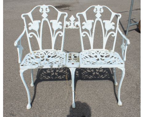 A cast metal Guernsey lily garden love seat or bench