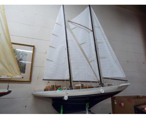 A very large twin masted pond yacht of wooden construction approximately 175 cm [h] including masts, 140 cm bow to stern and 