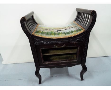 A Victorian piano stool with tapestry seat depicting a harbour scene