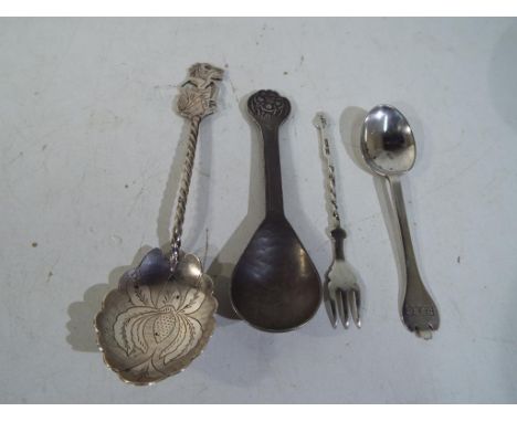 Two silver spoons, one silver fork and an Arts and crafts pewter spoon. Estimate £50 - £70