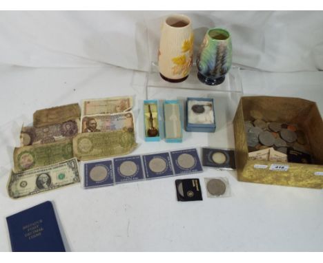 A quantity of coins pre- and post- decimalisation commemorative crowns, US coinage, foreign bank notes, also included are two