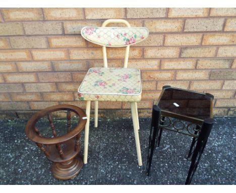 A vintage bathroom chair, a wooden plant stand and a metal and glass side table