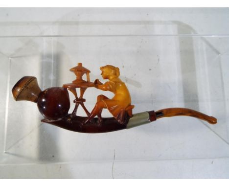 A cased Meerschaum pipe with broken mouth piece, carved as a young lady spinning, in original fitted leather case, Est £30 - 