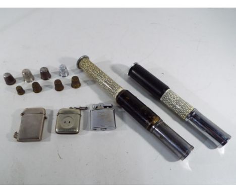 Two Otis King pocket calculators, a white metal Vesta case, two vintage lighters one a Ronson and the other a Thorens and a s