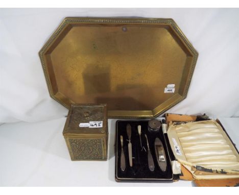 A hallmarked silver manicure set in presentation case Birmingham assay 1936, also included in the lot is a brass serving tray