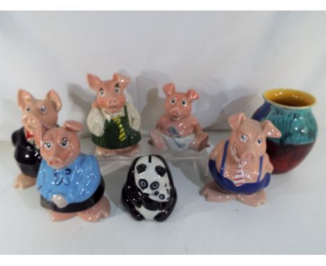 A set of five Wade ceramics NatWest pig money banks, Panda Group money bank and Poole pottery vase [7] Est £30 - £50.