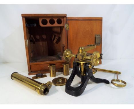 A scientific microscope in fitted mahogany case with internal drawer, the cabinet 26 cm (high)