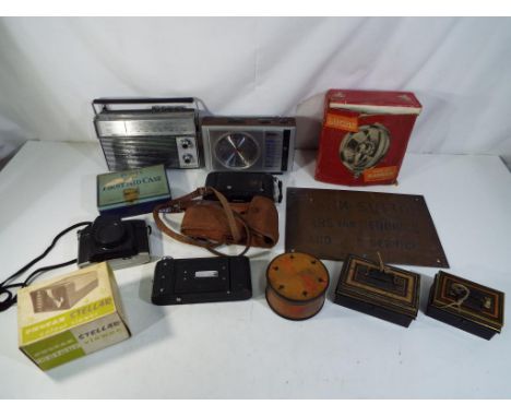 A lot to include vintage cameras, radios, first aid kit,cash tins and a Lucas Model 5LR Ranger spot lamp (appears unused in o