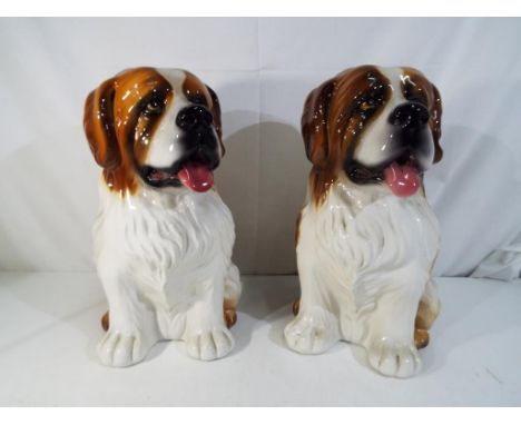 A pair of Italian ceramic figurines depicting St Bernard dogs, approximately 33 cm (h) (2)