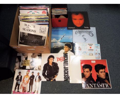 A lot to include in excess of 60 x 33.3 rpm vinyl records to include Status Quo, The Carpenters, Michael Jackson, Japan, Dead
