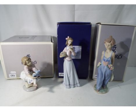Lladro - Three Lladro Collector's Society figurines comprising # 7644 Innocence in Bloom (in original box, # 7650 Pocket Full