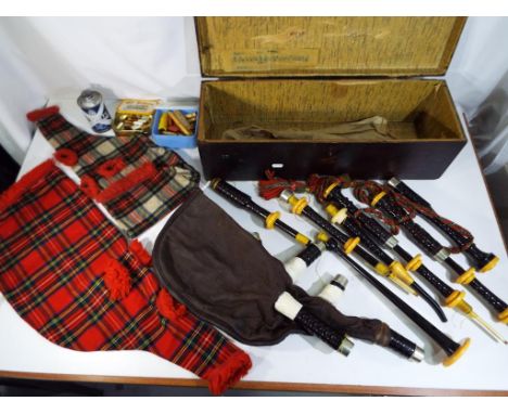 A R.G Lawrie Regal Scottish Bagpipes c 1940 in a wooden case, inscribed Partington Girls' Band Cheshire on a lid, comprising 