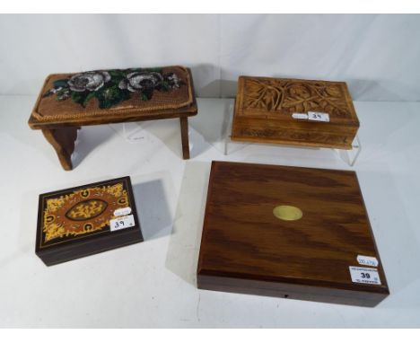 A lot to include a vintage bead work folding stool, a highly carved cigarette box and similar (4)