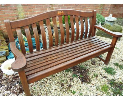 A good quality three-seater teak garden bench seat of classic design - Est £50 - £80