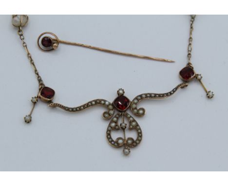 An Art Nouveau necklace with seed baroque pearls and garnets, 9ct and a stick pin in Bliss box. Garnet.