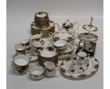 A Royal Albert Old Country Roses dinner and tea service. Comprising twelve dinner plates and pudding bowls, six teacups and s