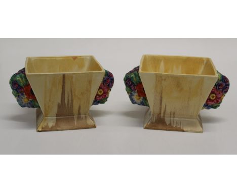 A pair of 1930's Clarice Cliff Bizarre My Garden flower pot vases. Each of square tapering form, with florally moulded handle