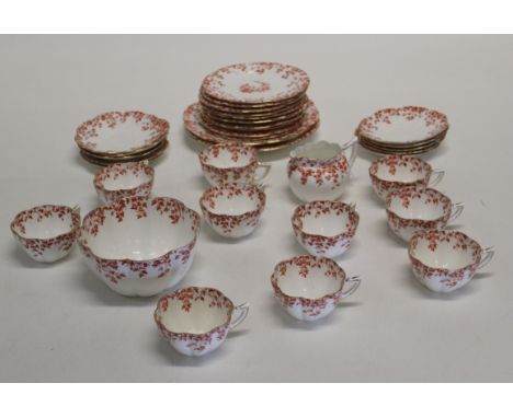 An Edwardian part tea service, red transfer design decorated with trailing ivy leaves. Registered number 175636