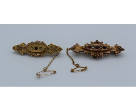 A 9ct rose gold seed pearl and red paste Victorian etruscan revival style brooch together with a similar example set with rub