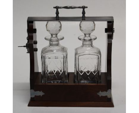 A late 20th century mahogany, EPNS mounted two bottle tantalus, with operating key, 29cm wide