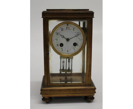 A late 19th century French four glass mantle clock, eight day movement striking upon a gong, faced by Arabic dial. 27cm high