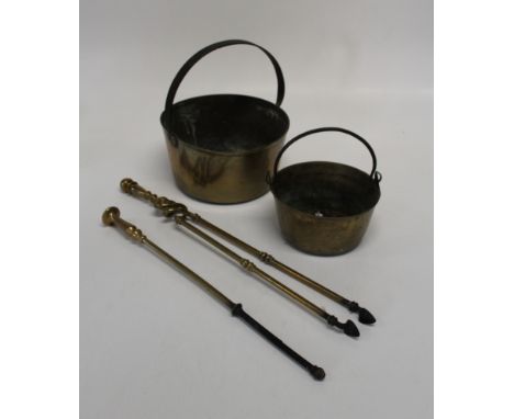 Two 19th century brass preserving pans and a pair of five tools