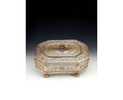  An Indian silver and gem set canted-rectangular casket,   unmarked, circa 1911, the slightly domed hinged cover centred by t