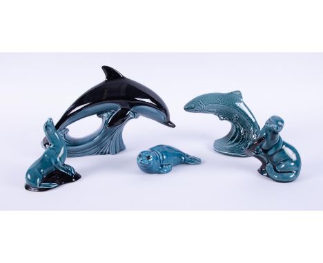 A small collection of Poole pottery animals including Dolphin, Otter, Seal etc (5).