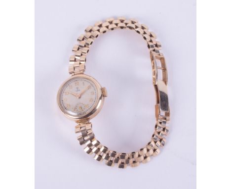 A vintage ladies 9ct yellow gold round faced, manual wind, Tudor wristwatch, the clasp is fully hallmarked, 18.78gm.