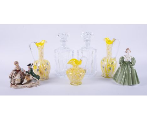 Two glass decanters with stoppers, set of three yellow coloured murano? glass, pair of German figures on a bench number stamp