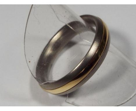 A titanium and 14 carat gold band ring, size W approx weight 4.1 grams