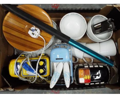 A good mixed lot to include ceramic tableware, horse brasses, a snow pick, money boxes and a camper van light