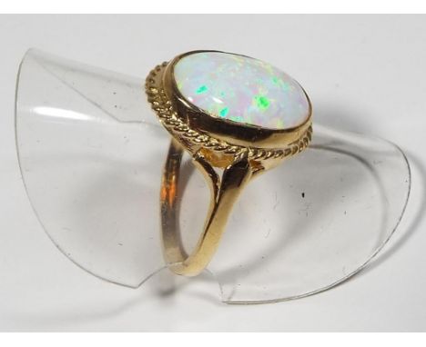 A lady's hallmarked 9 carat gold and opal ring, approx weight 3.1 grams, size O