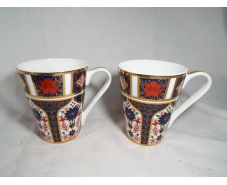 A pair of Royal Crown Derby ceramic mugs decorated in the Imari pattern 1103, 11 cm (h) x 9 cm (d). Estimate £20 - £40