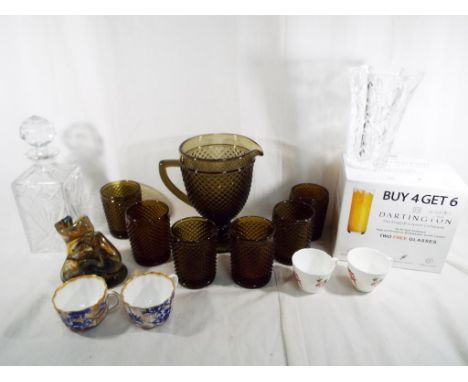A collection of predominantly good quality glassware to include a smoked glass lemonade set, a Mdina free form sculpture (uns