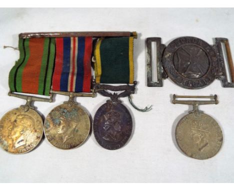 Four World War Two (WWII) campaign medals to include The Territorial Army Medal issued for Efficient Service, inscribed to th